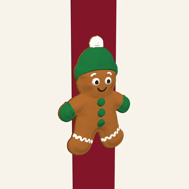Beanie and mittens gingerbread cookie on a ribbon, front view