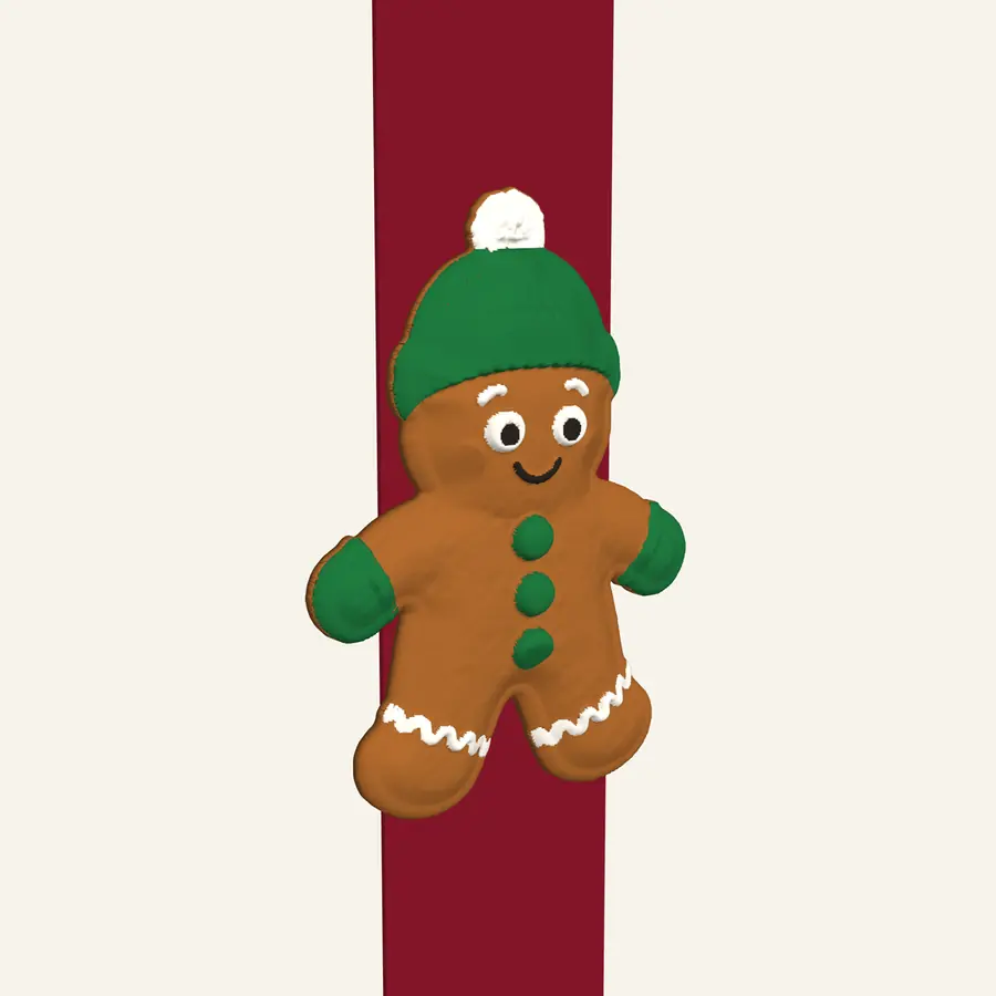 Beanie and mittens gingerbread cookie on a ribbon, front view