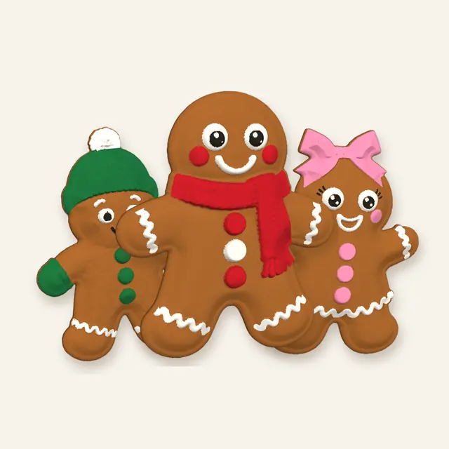The three gingerbread characters together: beanie and mittens, red scarf, and pink bow